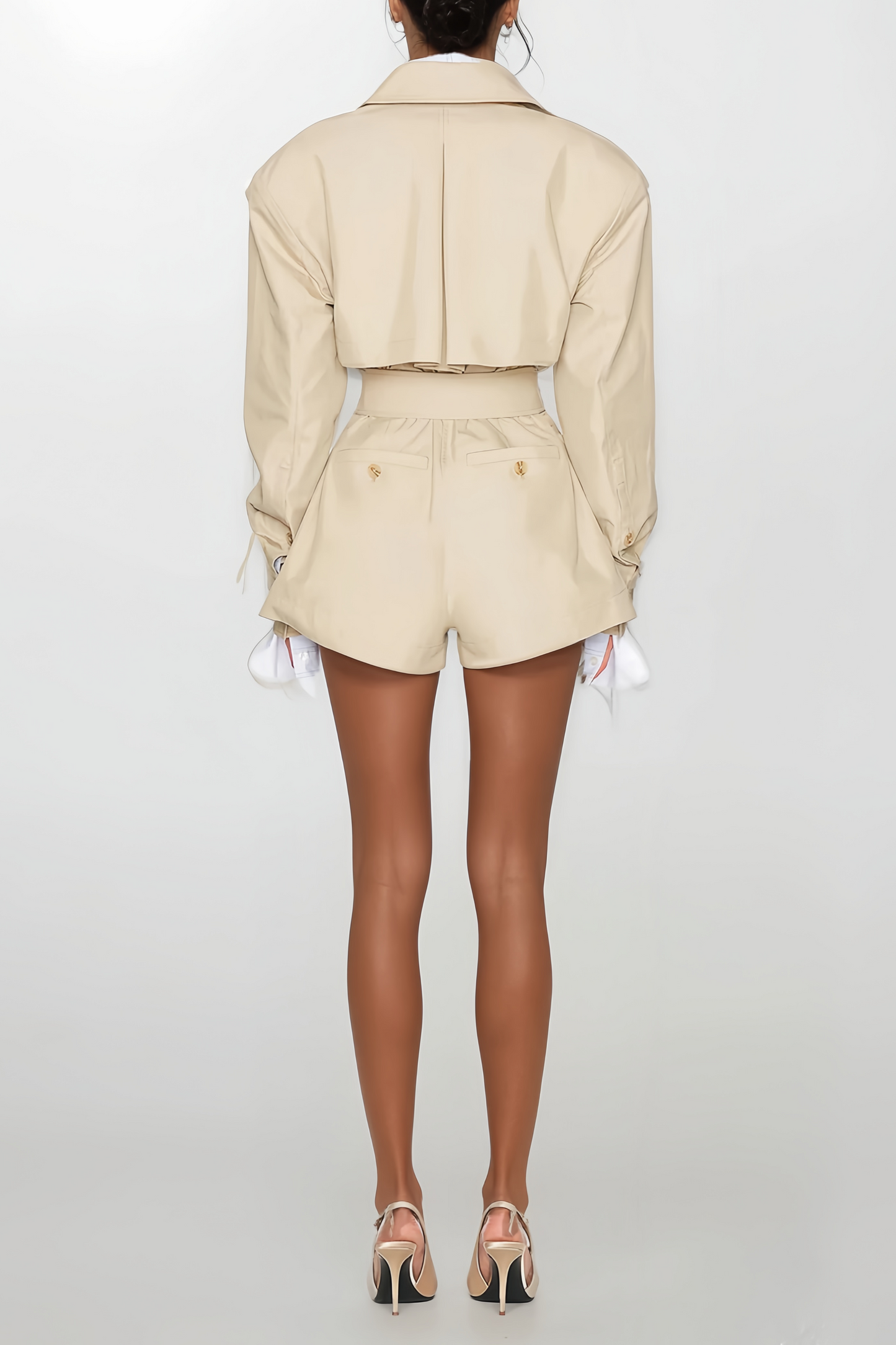 Tailored trench structure reinterpreted into a sculpted playsuit.