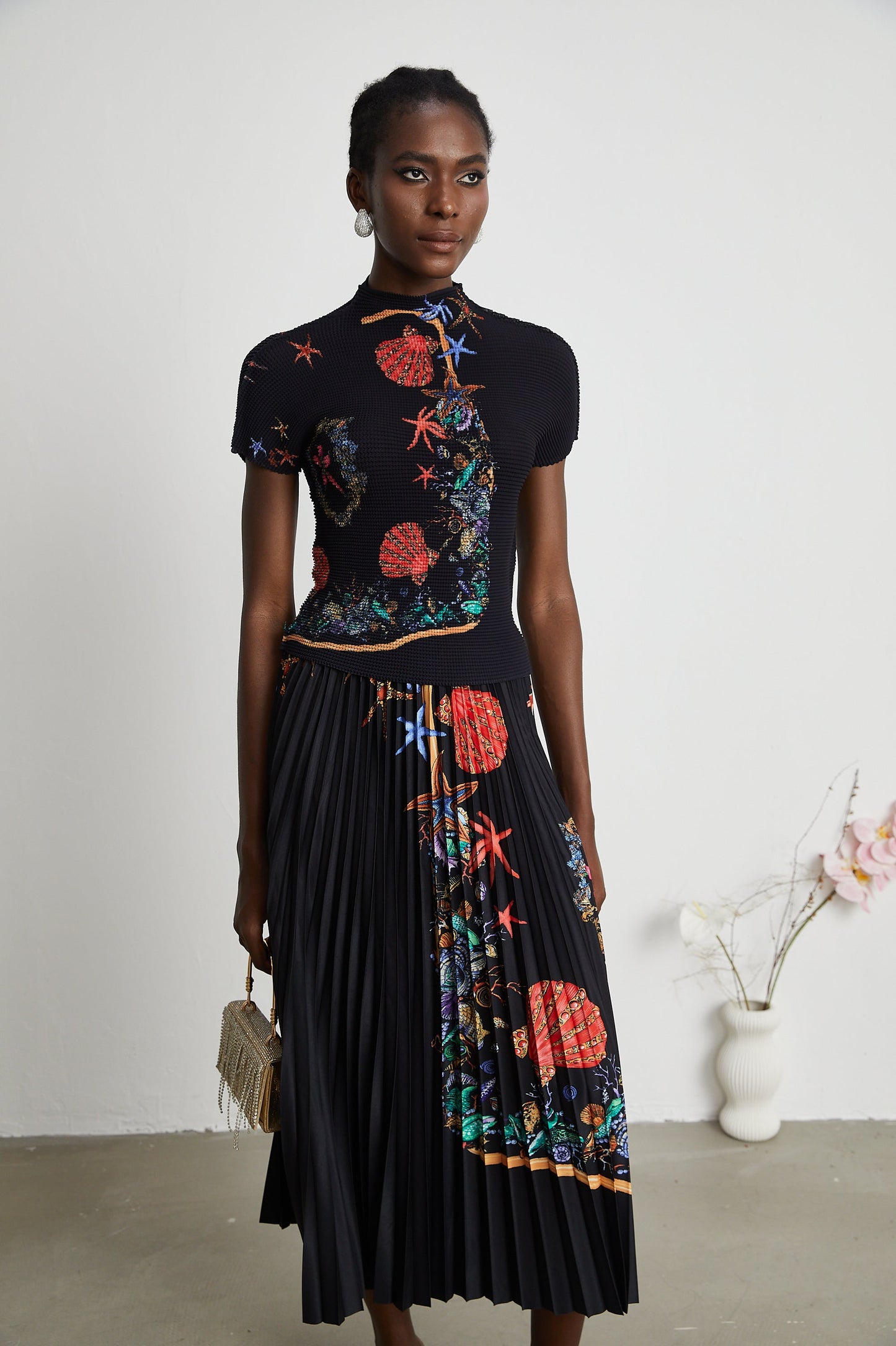 La Jardin Minuit — Printed knit top and pleated midi skirt