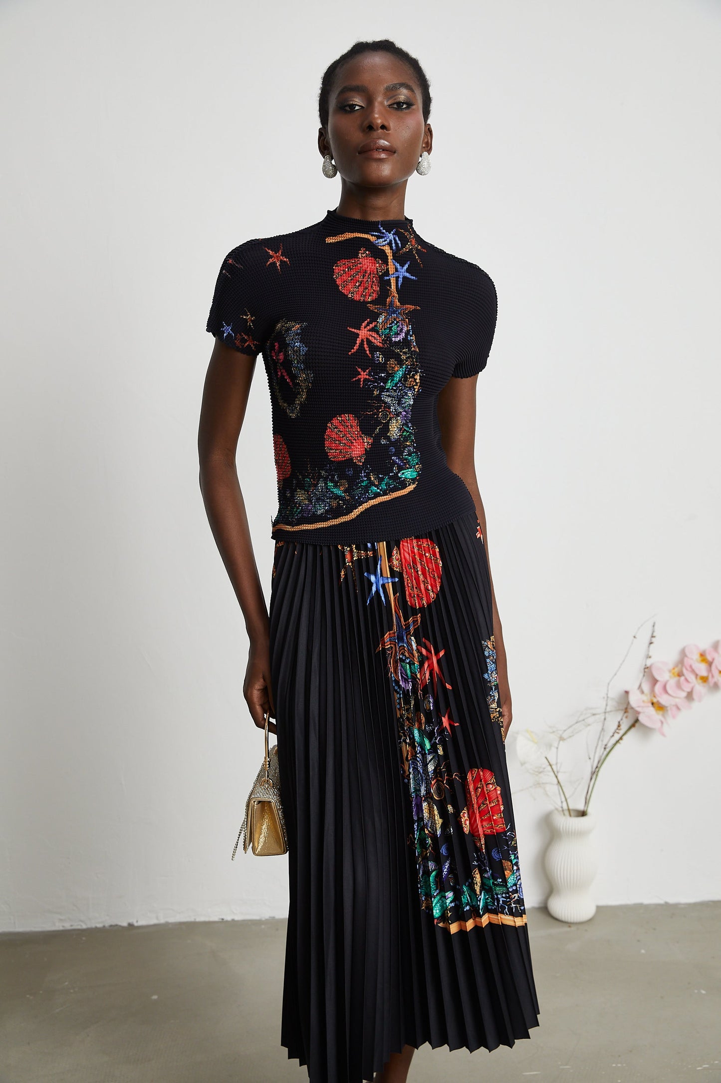 La Jardin Minuit — Printed knit top and pleated midi skirt