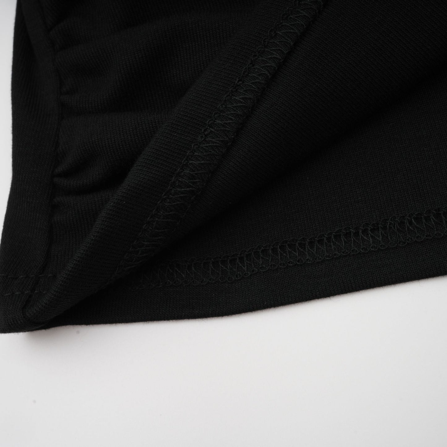 La Noir Drapée — Sculpted open-front top