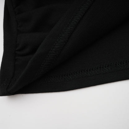 La Noir Drapée — Sculpted open-front top