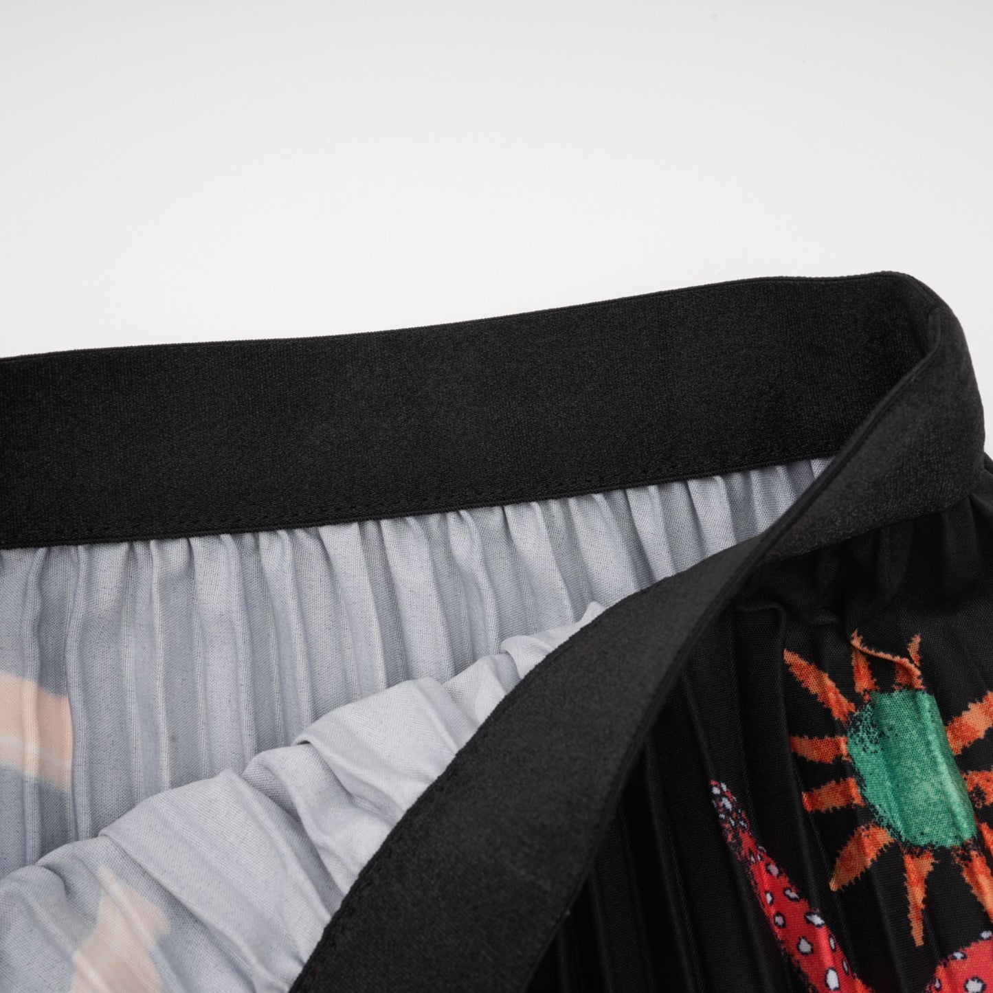 La Jardin Minuit — Printed knit top and pleated midi skirt