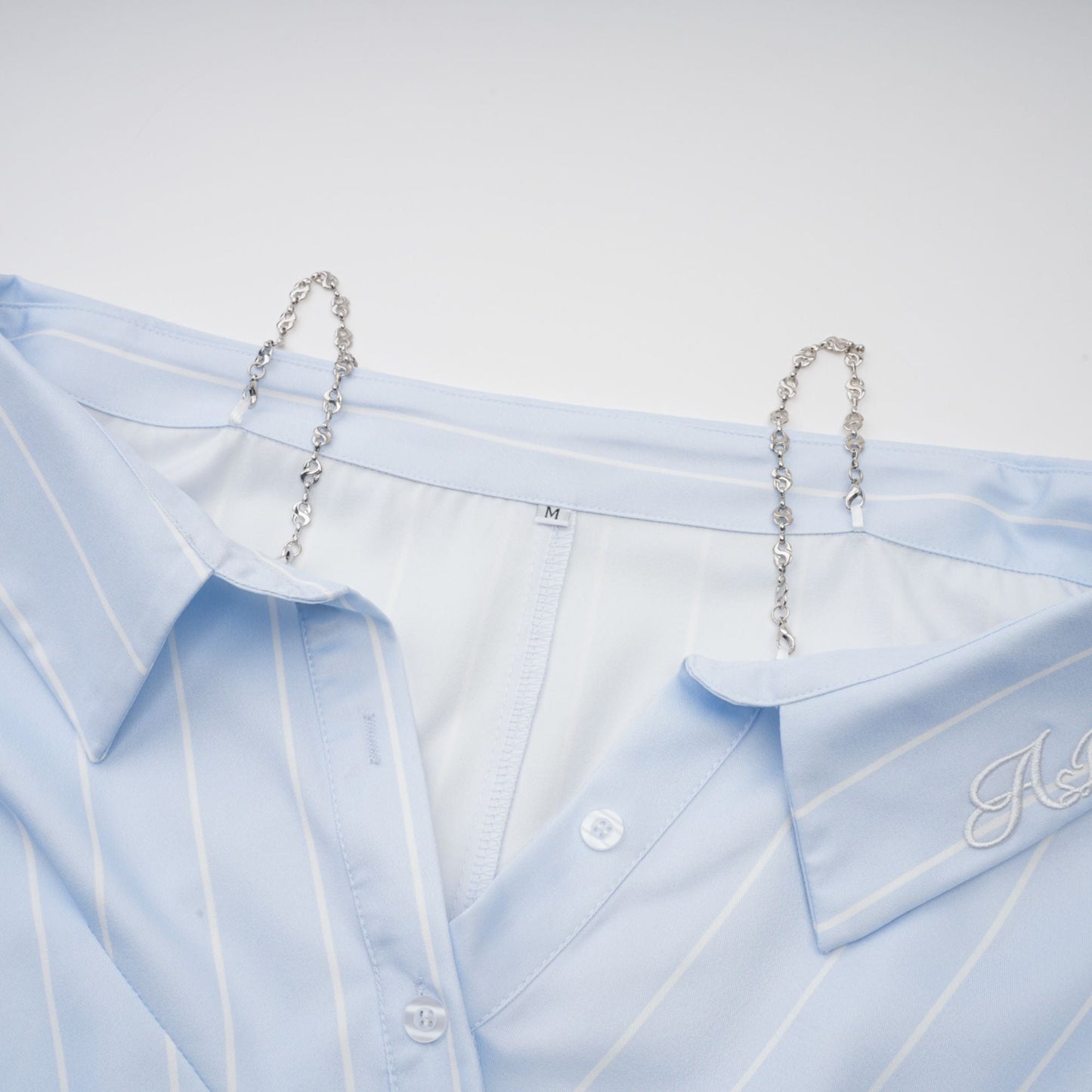 La Rayure Déstructurée — Off-shoulder striped cropped blouse