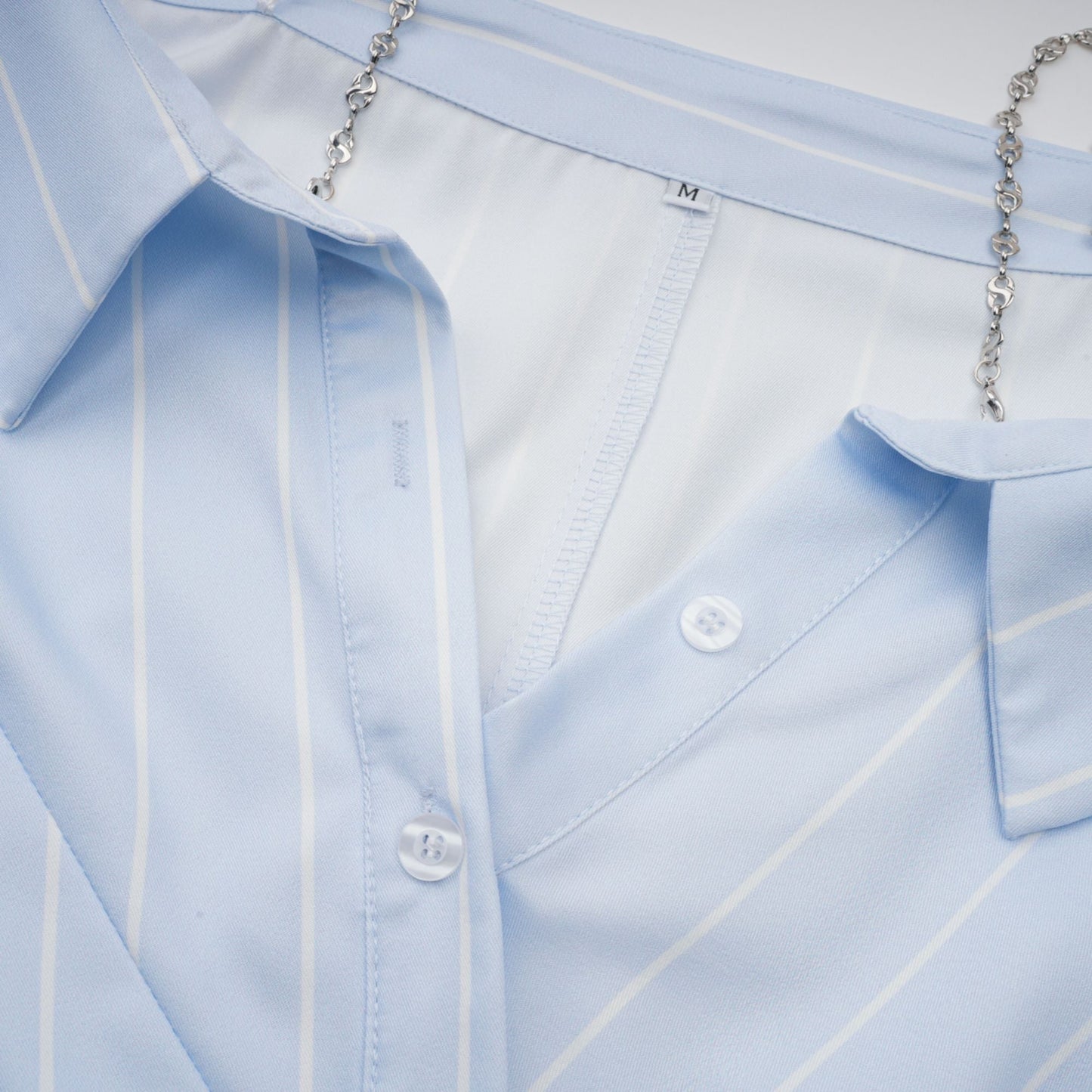 La Rayure Déstructurée — Off-shoulder striped cropped blouse