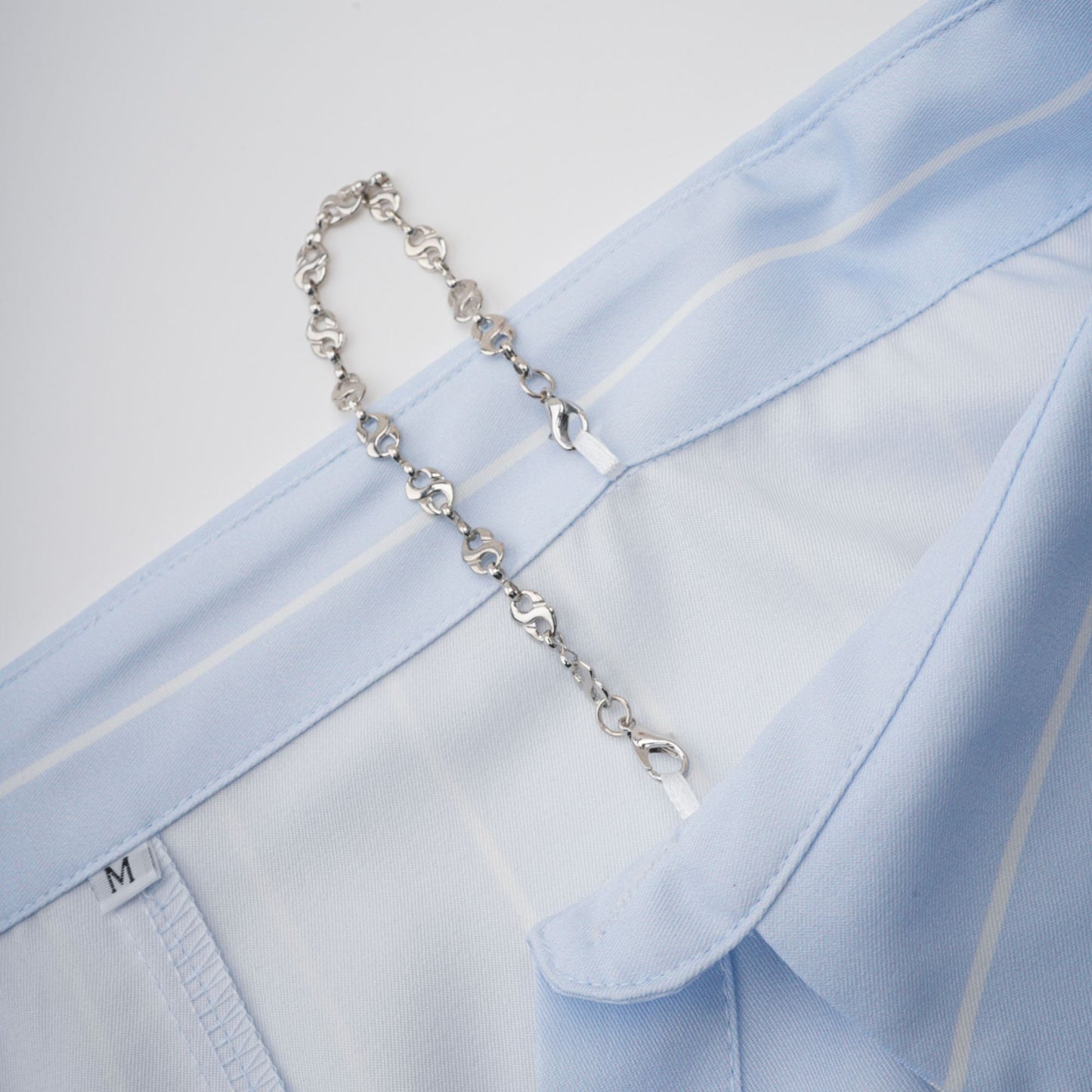 La Rayure Déstructurée — Off-shoulder striped cropped blouse