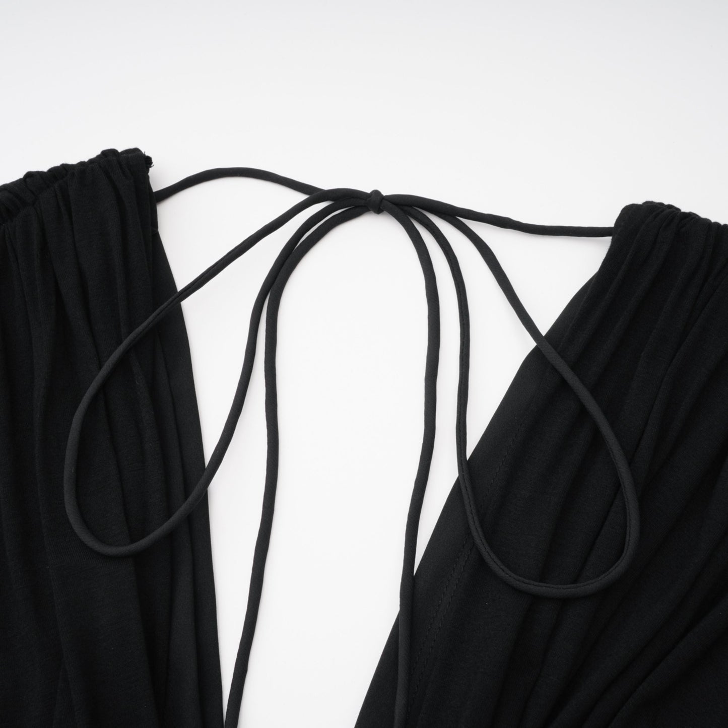 La Ligne Sculptée — Deep V twist-knot jumpsuit