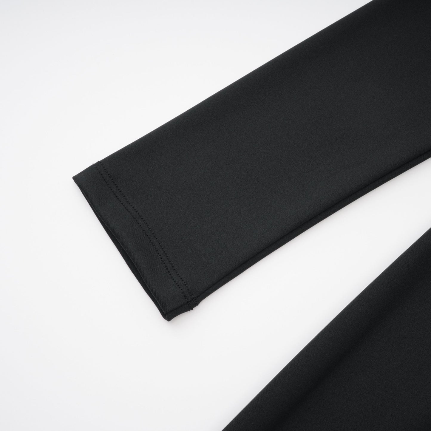 La Ligne Sculptée — Deep V twist-knot jumpsuit