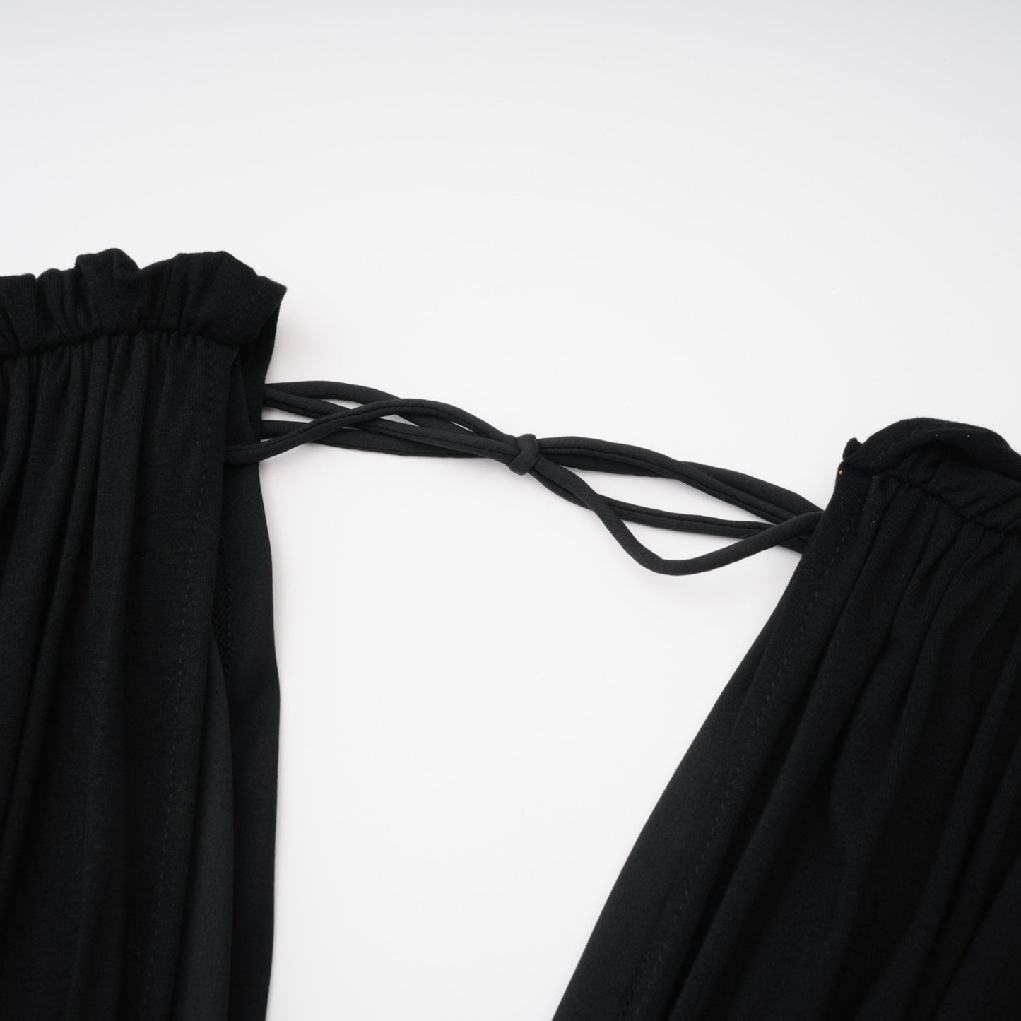 La Ligne Sculptée — Deep V twist-knot jumpsuit