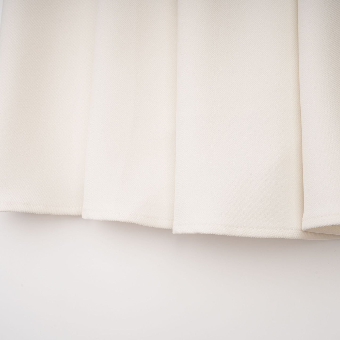 La Allure Blanche — Pearl-trim cropped jacket and pleated maxi skirt