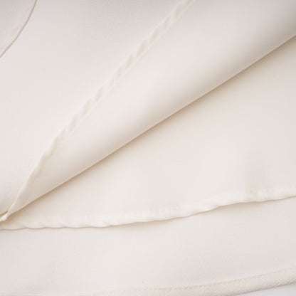 La Allure Blanche — Pearl-trim cropped jacket and pleated maxi skirt