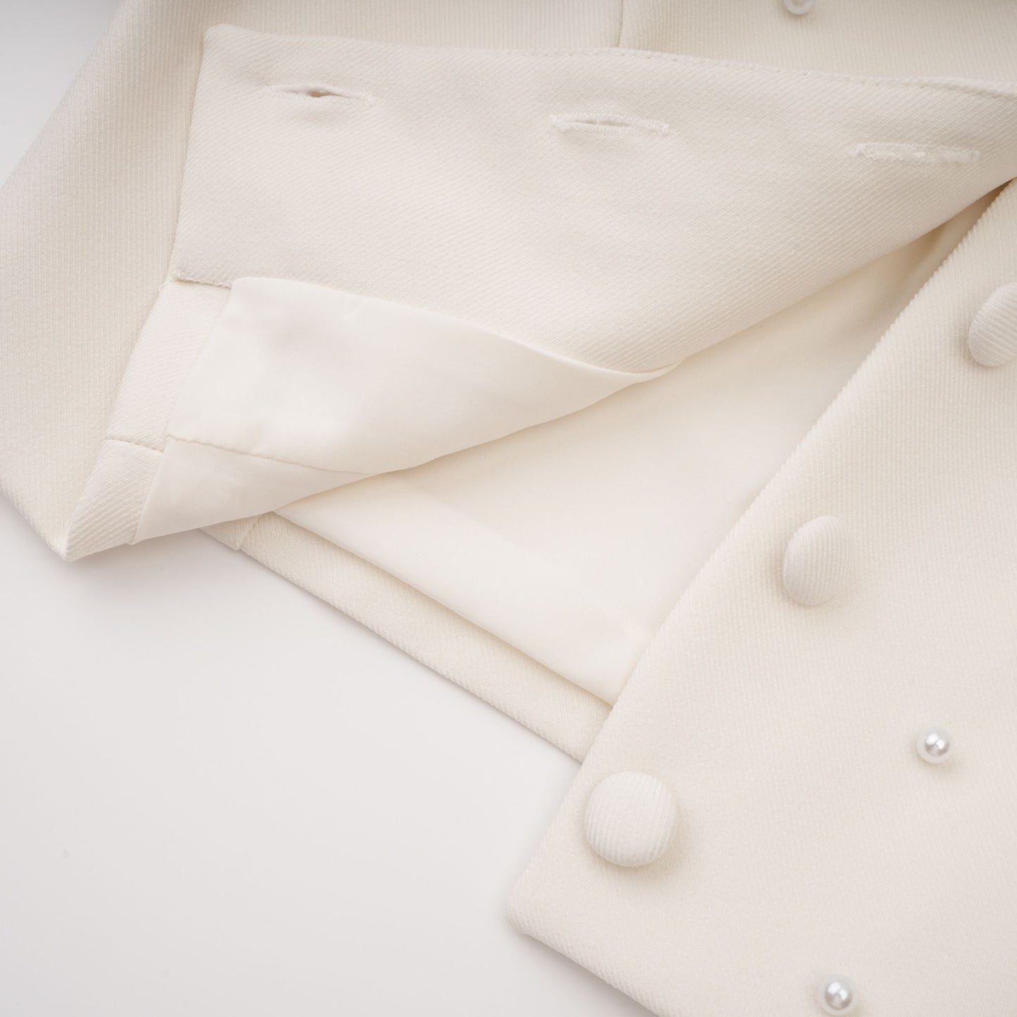 La Allure Blanche — Pearl-trim cropped jacket and pleated maxi skirt