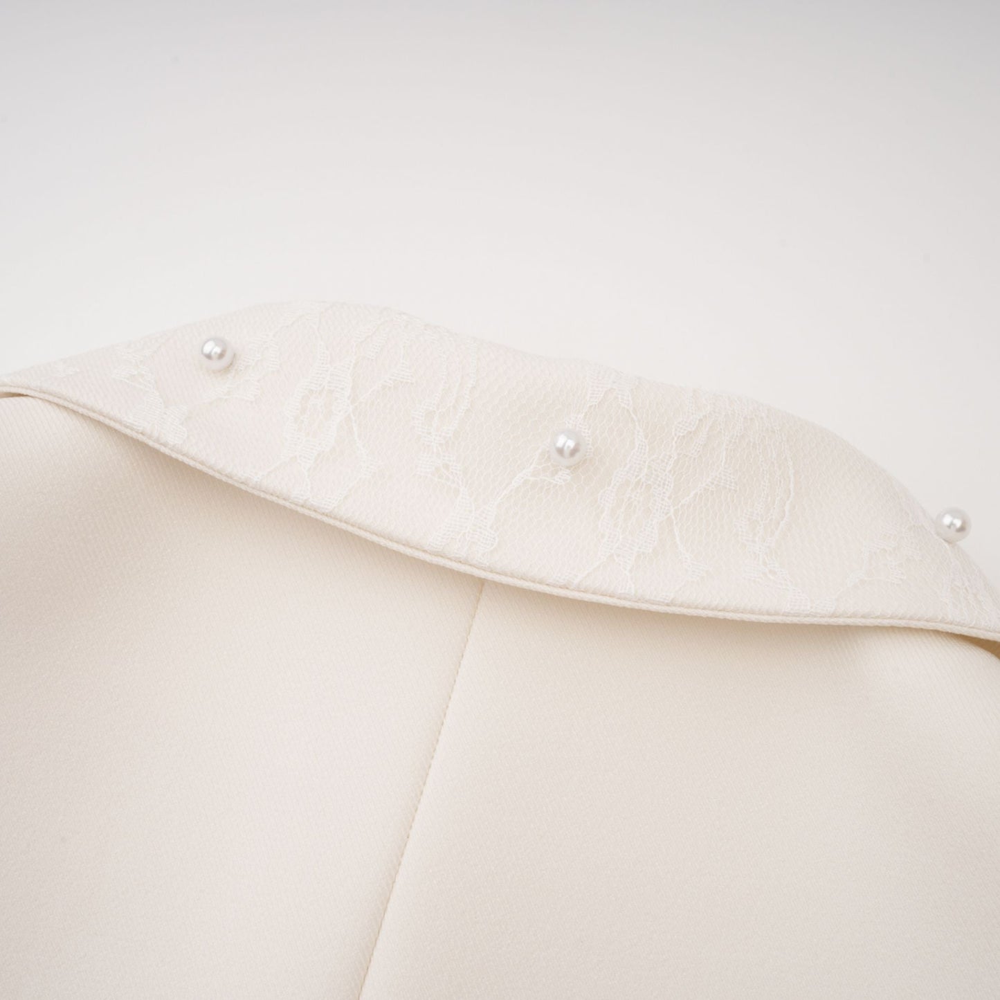 La Allure Blanche — Pearl-trim cropped jacket and pleated maxi skirt