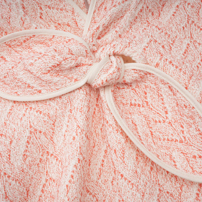 La Rosée — Bow-tie crochet blouse and petal mini skirt