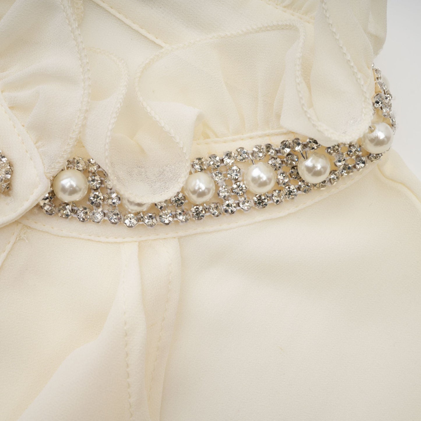 La Rêverie Éclat — Ruffled pearl and crystal blouse