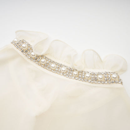 La Rêverie Éclat — Ruffled pearl and crystal blouse