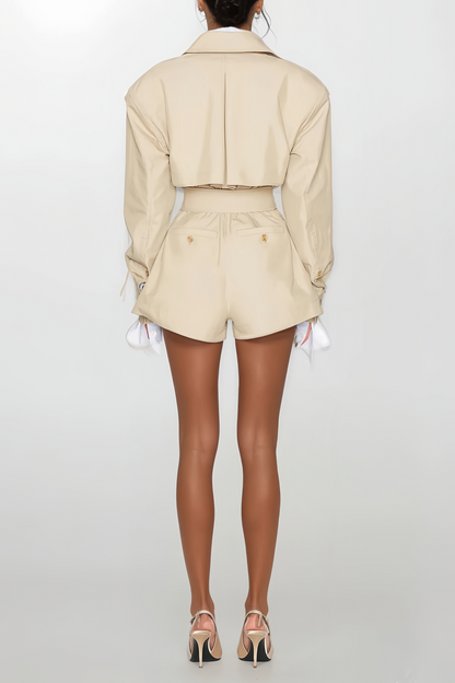 Tailored trench structure reinterpreted into a sculpted playsuit.